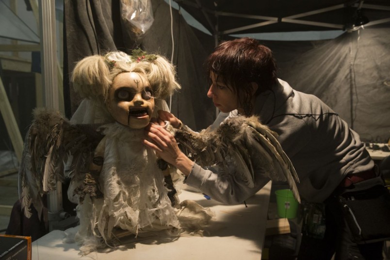 Weta Workshop technician Tree Harris works on the Cherub’s dress.
